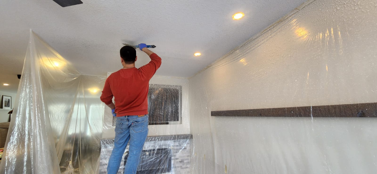 Knockdown ceiling texture contractor in Calgary completing finish work